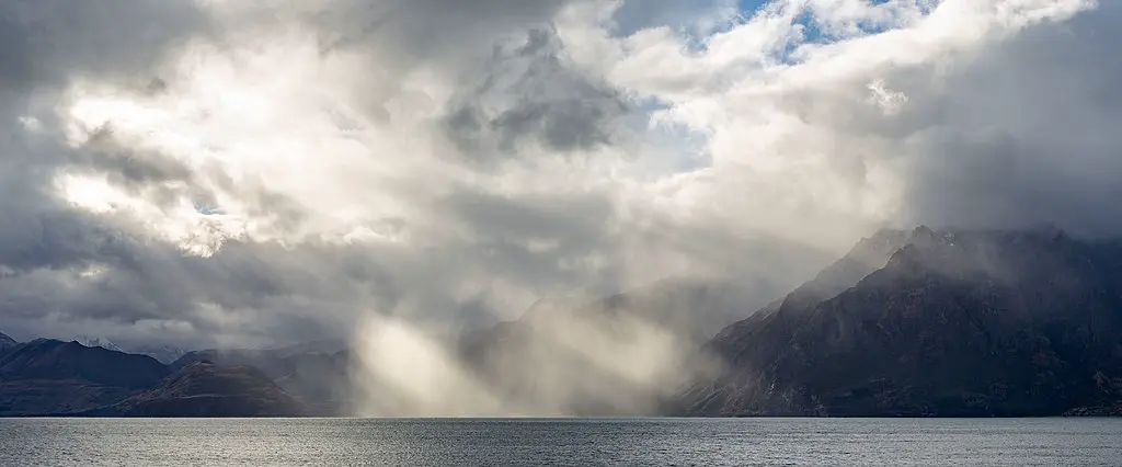 Beams of volumetric light over a lake